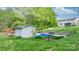 Backyard featuring a fenced pool area with a shed and ample seating at 5486 Suttlemyre Ln, Hickory, NC 28601