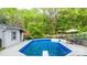 Backyard pool with a diving board, patio furniture, and fenced in for privacy at 5486 Suttlemyre Ln, Hickory, NC 28601
