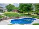 Beautiful in-ground pool, surrounded by landscaping in spacious backyard at 5486 Suttlemyre Ln, Hickory, NC 28601