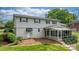 View of the back of the two story home featuring a screened in porch and an awning over the back door at 5486 Suttlemyre Ln, Hickory, NC 28601
