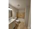 Bright bathroom featuring ceramic tile flooring, a modern vanity, and a shower-tub combination with tile surround at 6212 Snowcrest Ct, Charlotte, NC 28212