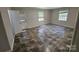 Neutral living room featuring ceramic tile flooring, neutral walls, and outdoor access at 6212 Snowcrest Ct, Charlotte, NC 28212