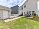 Backyard with a patio, seating area, grill, fenced perimeter, and green grass at 6312 Kennard Dr, Charlotte, NC 28216
