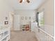 Charming Bedroom featuring a crib, dresser, and cheerful decor, creating a warm and inviting space at 6312 Kennard Dr, Charlotte, NC 28216