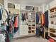 Walk-in closet with custom shelving, hanging racks, and ample storage space for clothes and accessories at 6312 Kennard Dr, Charlotte, NC 28216