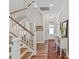 Bright foyer featuring hardwood floors, staircase, and decorative accents, creating a welcoming entrance at 6312 Kennard Dr, Charlotte, NC 28216