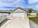 Exterior shot of a detached two-car garage with white siding and a concrete driveway at 6312 Kennard Dr, Charlotte, NC 28216