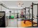 Fully equipped home gym with weightlifting equipment and large windows at 6312 Kennard Dr, Charlotte, NC 28216