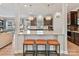 Open concept kitchen with granite countertops, stainless steel appliances, and barstool seating at 6312 Kennard Dr, Charlotte, NC 28216