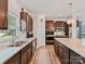 Spacious kitchen with stainless steel appliances, granite countertops, and dark wood cabinets at 6312 Kennard Dr, Charlotte, NC 28216