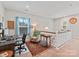 Comfortable carpeted loft space with a desk, accent chair, and view of the neighborhood through the windows at 6312 Kennard Dr, Charlotte, NC 28216