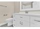 Bathroom with sleek white vanity and modern fixtures; features a clean, minimalist design at 6600 Knightswood Dr, Charlotte, NC 28226