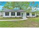Charming single-story home with a landscaped front yard and a freshly-painted exterior at 6600 Knightswood Dr, Charlotte, NC 28226