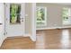 Bright living room featuring hardwood floors, neutral walls, and a view to the backyard at 6600 Knightswood Dr, Charlotte, NC 28226