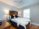 Bedroom featuring hardwood floors, white trim, with a ceiling fan and natural light at 6616 Williams Rd, Charlotte, NC 28215
