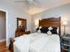 Bedroom featuring hardwood floors, white trim, with a ceiling fan and natural light at 6616 Williams Rd, Charlotte, NC 28215