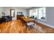 Dining room with hardwood floors, large windows, and a full table at 6616 Williams Rd, Charlotte, NC 28215