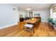 Dining room with hardwood floors, a large table, and natural light at 6616 Williams Rd, Charlotte, NC 28215