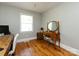 Bright home office featuring hardwood floors, natural light, and a wooden vanity at 6616 Williams Rd, Charlotte, NC 28215