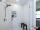 Newly tiled shower with glass enclosure, a niche, and a modern showerhead fixture at 6616 Williams Rd, Charlotte, NC 28215