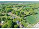 Scenic aerial view of the neighborhood with lush trees, green fields, and well-spaced homes at 695 Linwood Rd, Mooresville, NC 28115