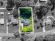 Aerial view showing approximate lot lines, house, driveway, and surrounding mature landscaping at 695 Linwood Rd, Mooresville, NC 28115