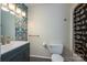 Stylish bathroom with floral wallpaper, a modern vanity, and a shower at 695 Linwood Rd, Mooresville, NC 28115