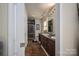 Bathroom with double vanity, tiled floor, and glass-enclosed shower at 695 Linwood Rd, Mooresville, NC 28115