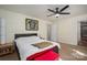 Bedroom featuring a sports jersey, ceiling fan, and ensuite bathroom at 695 Linwood Rd, Mooresville, NC 28115