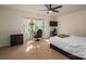 Bright bedroom with bay window, a desk, and a ceiling fan at 695 Linwood Rd, Mooresville, NC 28115