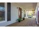 Relaxing front porch showcasing a swing, decorative door, and ample space for outdoor seating at 695 Linwood Rd, Mooresville, NC 28115