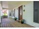 Charming front porch featuring a decorative door, seasonal flowers, and classic architectural details at 695 Linwood Rd, Mooresville, NC 28115