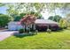 Inviting home featuring a well-maintained lawn, mature trees, and attached two-car garage, offering suburban charm at 695 Linwood Rd, Mooresville, NC 28115