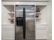 Modern kitchen with stainless steel refrigerator and built-in shelves at 695 Linwood Rd, Mooresville, NC 28115