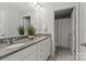 Bathroom featuring a double vanity with granite countertops, white cabinetry, and framed mirrors at 7039 Chrysanthemum Rd, Lancaster, SC 29720