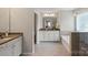 Bathroom featuring double vanities, a soaking tub, and a separate shower for a spa-like experience at 7039 Chrysanthemum Rd, Lancaster, SC 29720