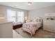 Charming bedroom featuring a single bed, neutral walls, a dresser, and a cozy atmosphere at 7039 Chrysanthemum Rd, Lancaster, SC 29720