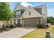 Beautiful two-story home with stone accents, a two-car garage, and a well-manicured front yard at 7039 Chrysanthemum Rd, Lancaster, SC 29720