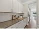 Bright kitchen featuring a countertop, white cabinets, and white subway tile backsplash at 7039 Chrysanthemum Rd, Lancaster, SC 29720