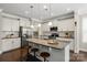 Modern kitchen with an island, stainless steel appliances, granite countertops, and pendant lighting at 7039 Chrysanthemum Rd, Lancaster, SC 29720