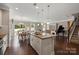 Open-concept kitchen with a large island, stainless steel appliances, and seamless flow into the living spaces at 7039 Chrysanthemum Rd, Lancaster, SC 29720