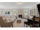 Bright living room with fireplace, windows, and view to backyard patio at 7039 Chrysanthemum Rd, Lancaster, SC 29720