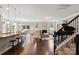Open concept kitchen and living room with stainless appliances and a grand piano at 7039 Chrysanthemum Rd, Lancaster, SC 29720