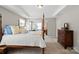 Lovely main bedroom with a four-poster bed, neutral walls, and carpeted floors for a cozy feel at 7039 Chrysanthemum Rd, Lancaster, SC 29720