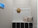 Functional mudroom with a board and batten wall and cubbies for organized storage at 7039 Chrysanthemum Rd, Lancaster, SC 29720