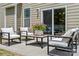 Outdoor patio furnished with comfortable seating for relaxing and entertaining outdoors at 7039 Chrysanthemum Rd, Lancaster, SC 29720
