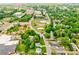 Wide aerial of the property, local parks, commercial, and downtown districts, showing the neighborhood setting at 704 E Catawba St, Belmont, NC 28012