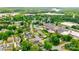Aerial view of the property, its location in the neighborhood, and nearby commercial and industrial area at 704 E Catawba St, Belmont, NC 28012