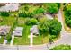 Aerial view of home with well-maintained lawn, driveway, and mature trees surrounding the property at 704 E Catawba St, Belmont, NC 28012
