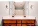 Bathroom featuring double sinks and shower with bronze fixtures at 704 E Catawba St, Belmont, NC 28012